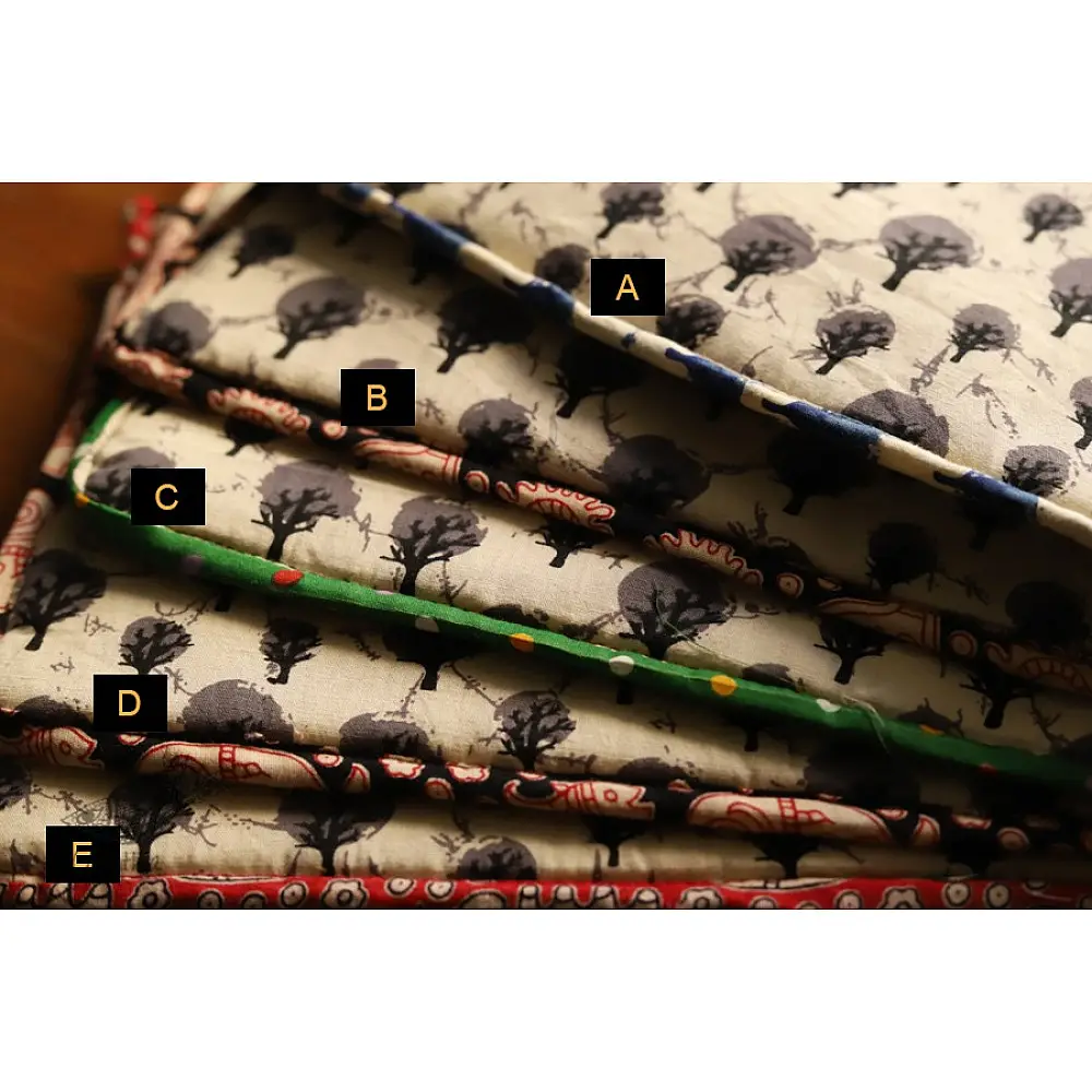 beige cotton iPad cover with grey block-printed tree motif and multicolour striped border