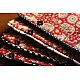 red cotton iPad cover with white block-printed elephant and paisley motifs and polka dot border