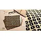 beige cotton iPad cover with black block-printed rounded square geometric motif