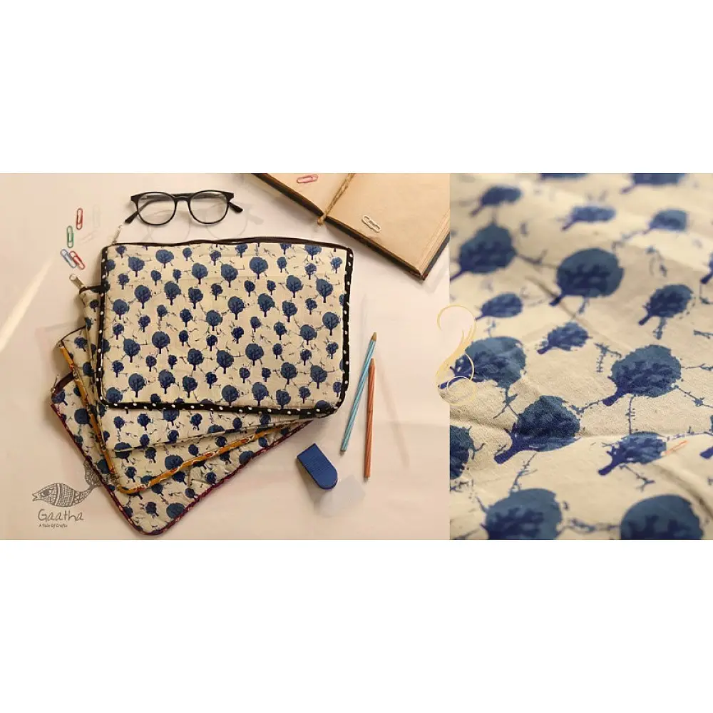 beige cotton iPad cover with indigo blue block-printed tree motif and polka dot border