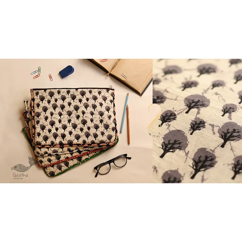 beige cotton iPad cover with grey block-printed tree motif and multicolour striped border