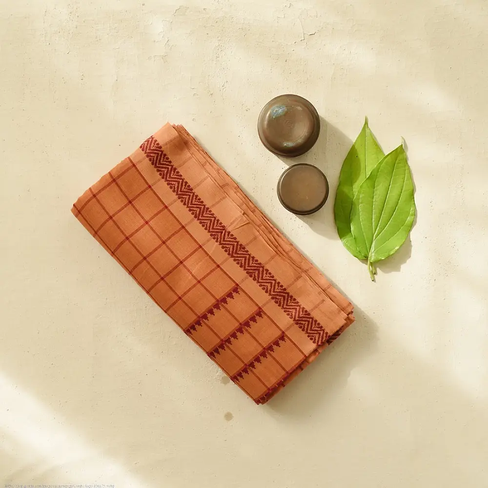 handloom begampuri pure cotton saree in rust brown with red fine grid check pattern, woven temple borders, and tassel fringe