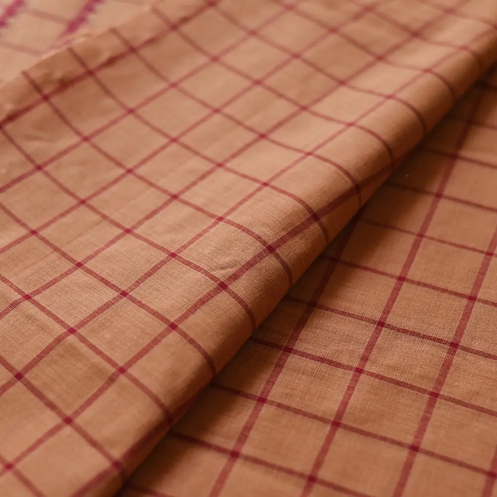 handloom begampuri pure cotton saree in rust brown with red fine grid check pattern, woven temple borders, and tassel fringe