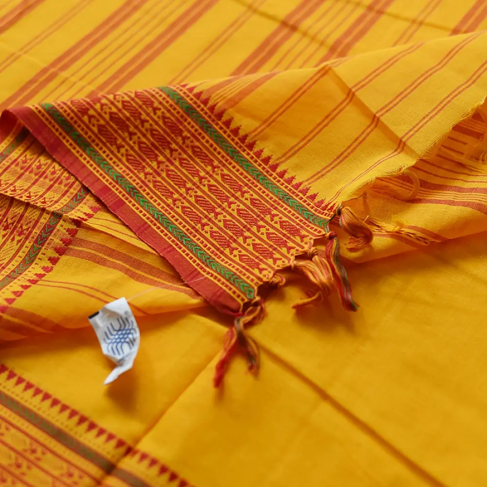 handloom begampuri pure cotton saree in bright yellow with orange and green woven temple borders and tassel fringe   