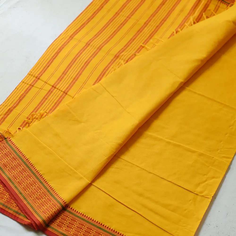 handloom begampuri pure cotton saree in bright yellow with orange and green woven temple borders and tassel fringe   