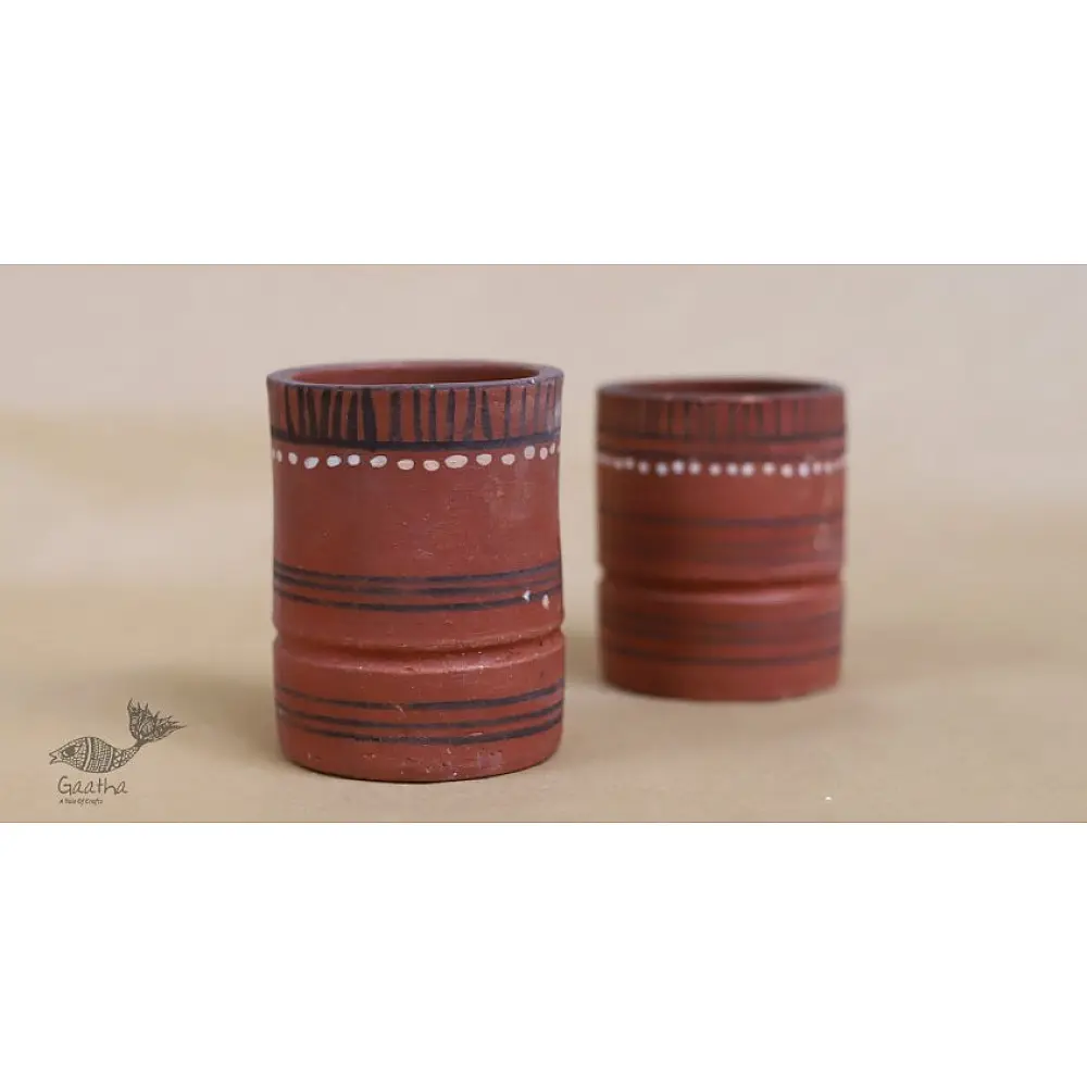 handmade terracotta clay glasses set of two with hand painted traditional tribal white and black line motifs