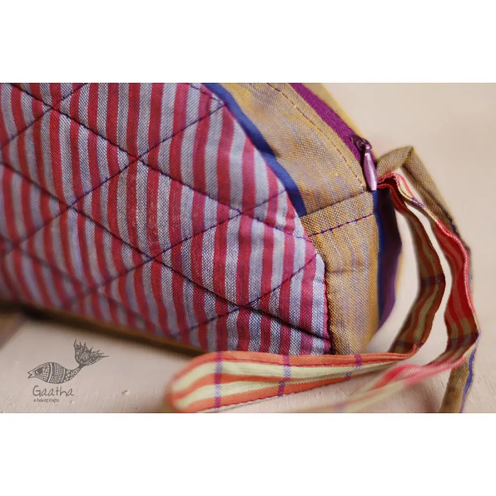 handcrafted camel shaped cotton pouch featuring a pink diamond quilted saddle panel and long fabric strap