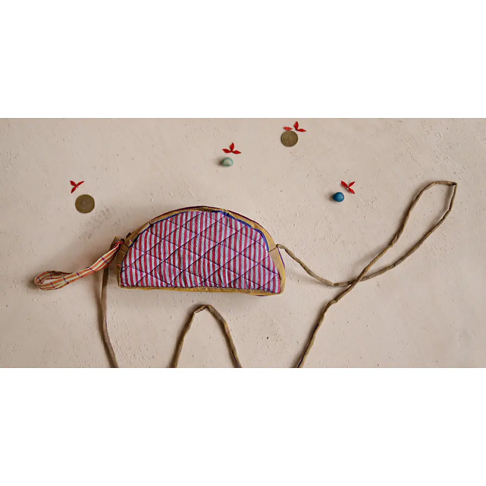 handcrafted camel shaped cotton pouch featuring a pink diamond quilted saddle panel and long fabric strap