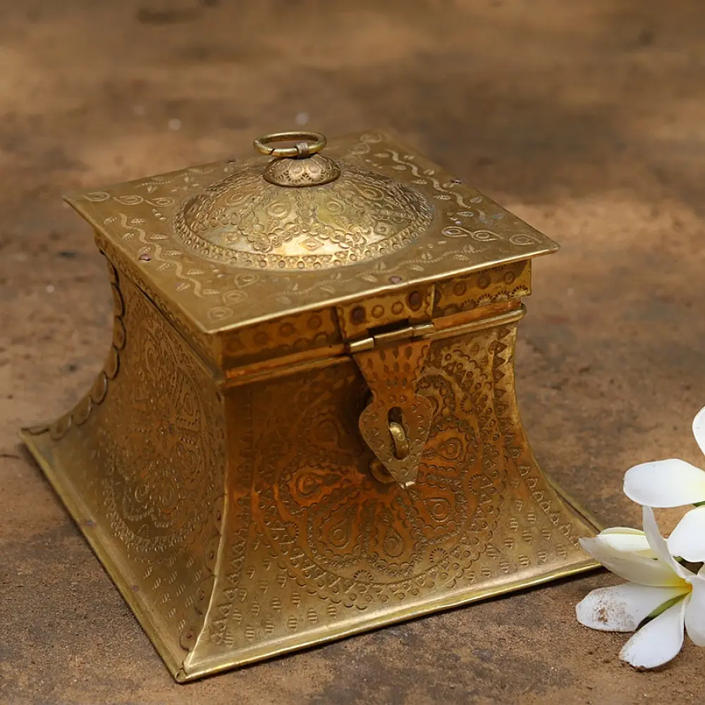 handmade square brass dabro storage box with flared base front clasp and hand engraved patterns