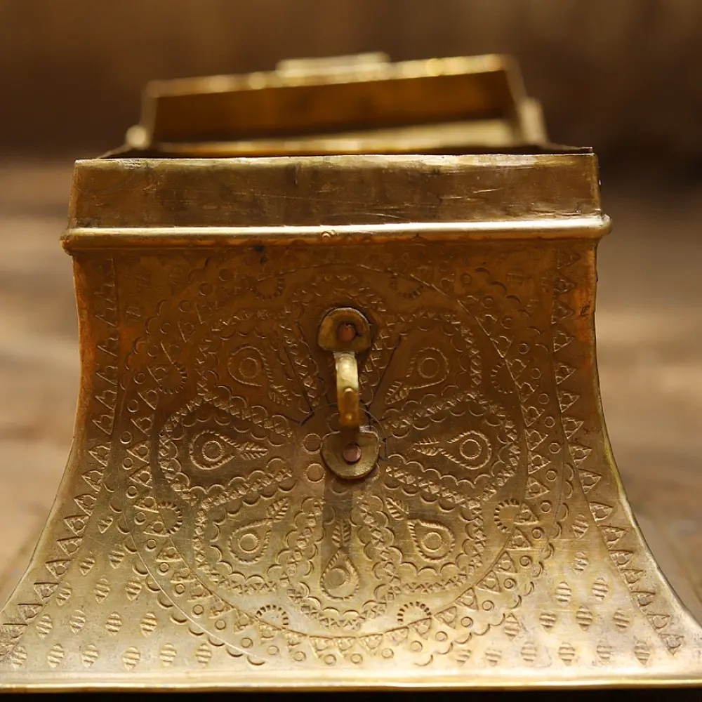 handmade square brass dabro storage box with flared base front clasp and hand engraved patterns