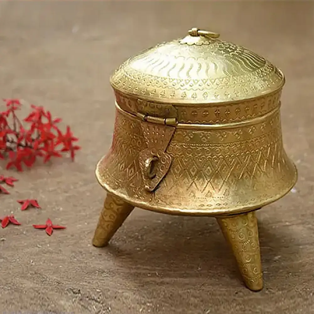 handmade traditional brass paan daan featuring three sturdy tripod legs, a hand-engraved dome lid, and a secure metal latch closure