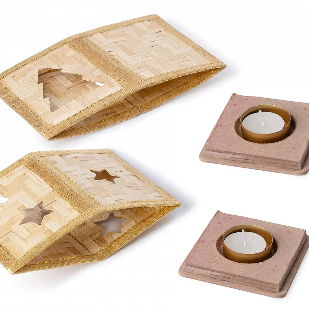 handcrafted square bamboo tea light holders featuring a cutout star and a cutout christmas tree panel with woven gold ribbon borders