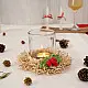 handcrafted natural bamboo fiber frill tea light holder with red and green crochet flower accents holding a clear glass candle cup on a festive display table