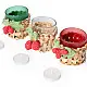 handcrafted banana bark woven tea light holders with green and red crochet holly berry accents holding colored glass candle cups on a festive table display