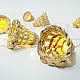 handcrafted banana bark fiber bell fairy lights emitting a warm amber glow against a textured white brick wall pattern