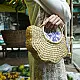 Natural handcrafted water reed handbag with a woven texture, rounded handles and a spacious fabric-lined interior