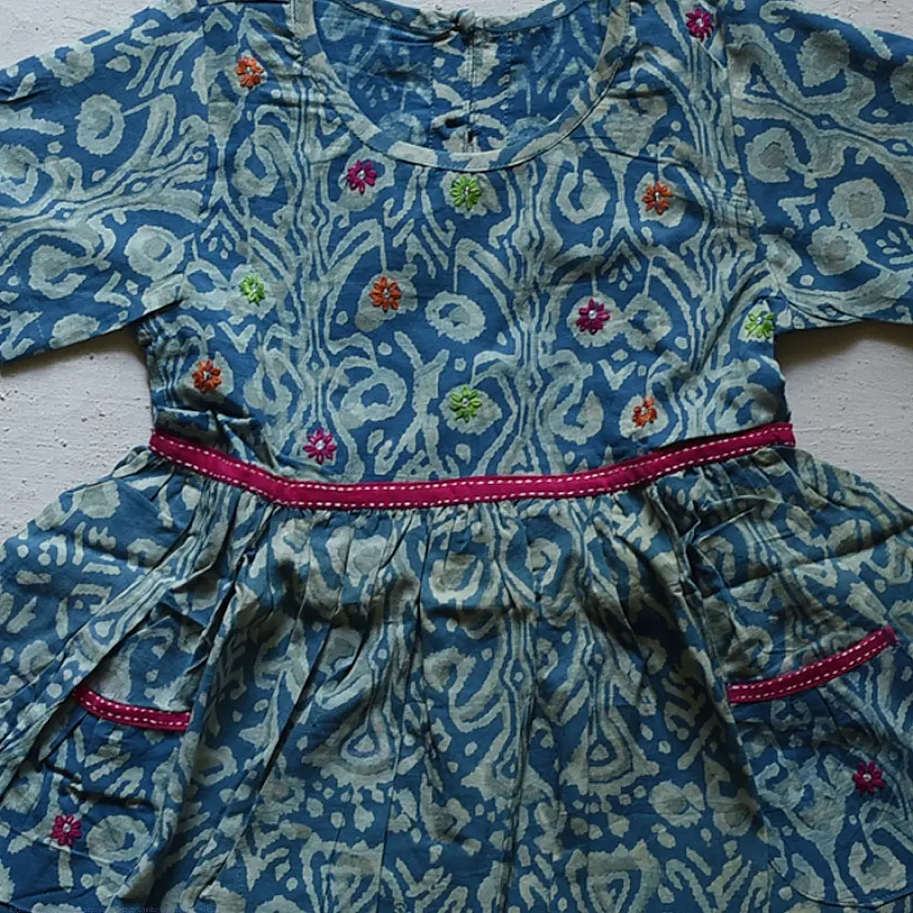blue pure cotton girls frock with floral print pink piping and embroidered details