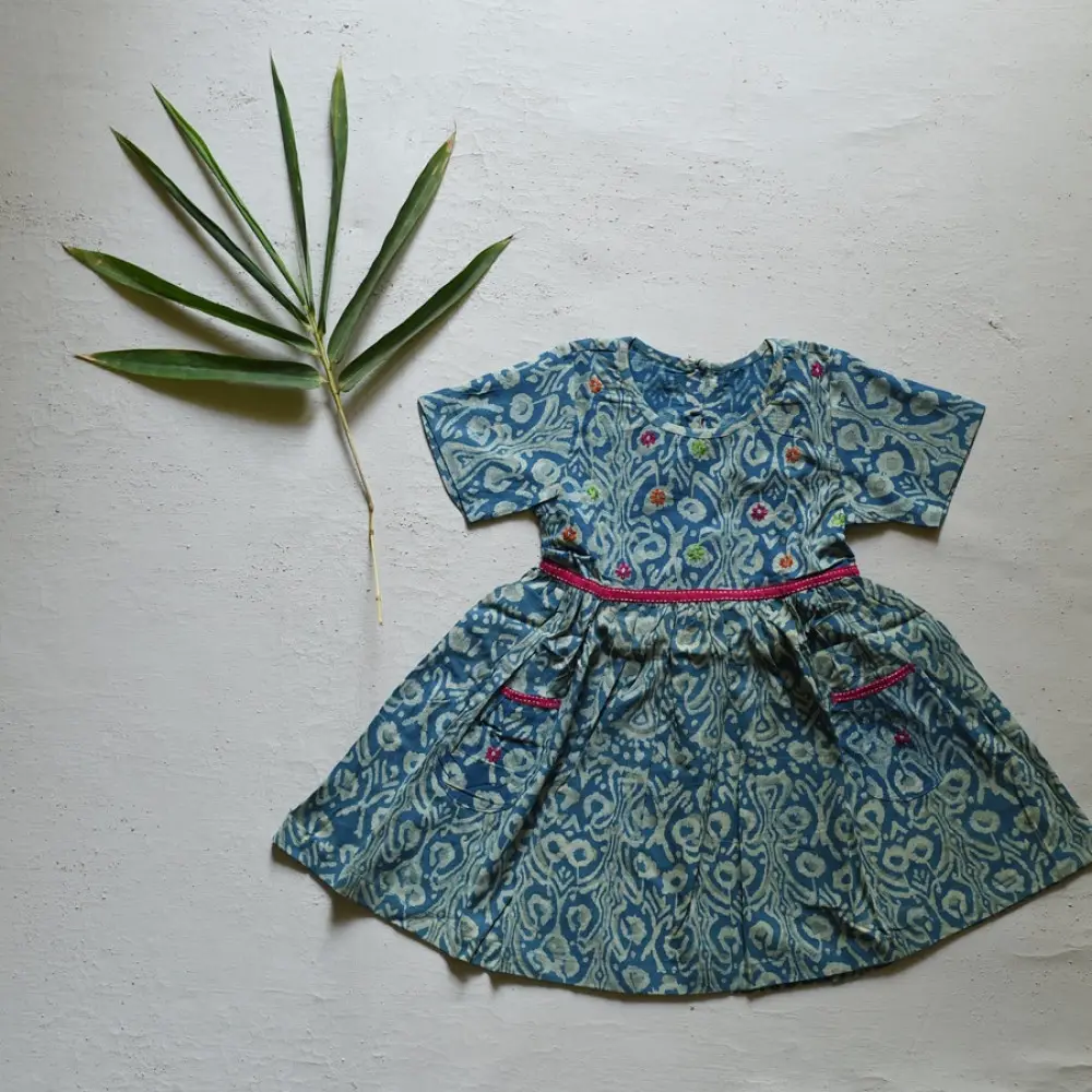 blue pure cotton girls frock with floral print pink piping and embroidered details