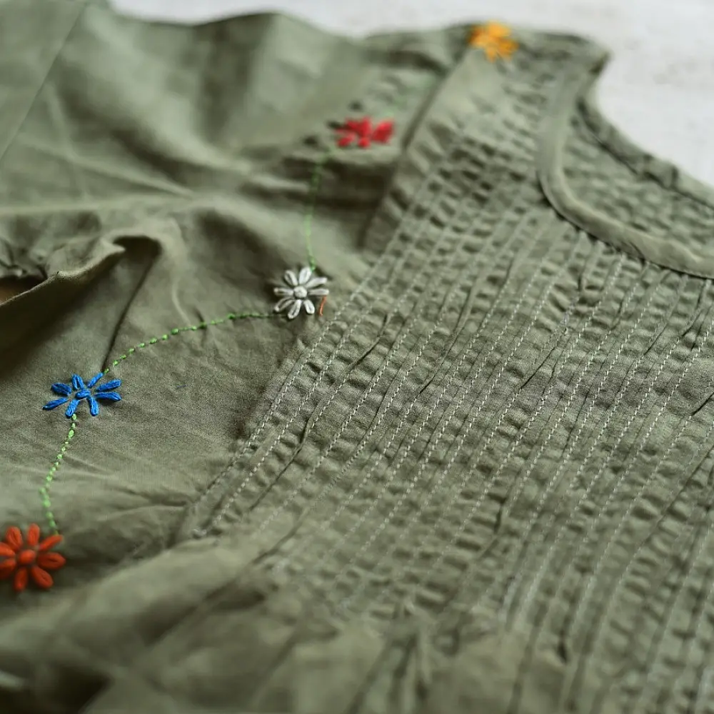 olive green pure cotton girls frock with pintucks floral embroidery and embroidered patch pockets