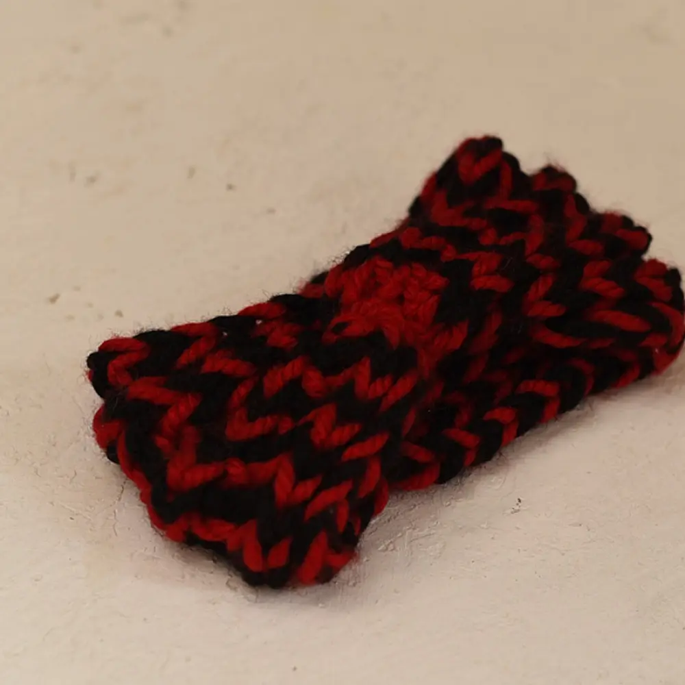 black red hand knitted himalayan woolen socks textured geometric pattern matching red black flower hairband winter foot warmers gaatha