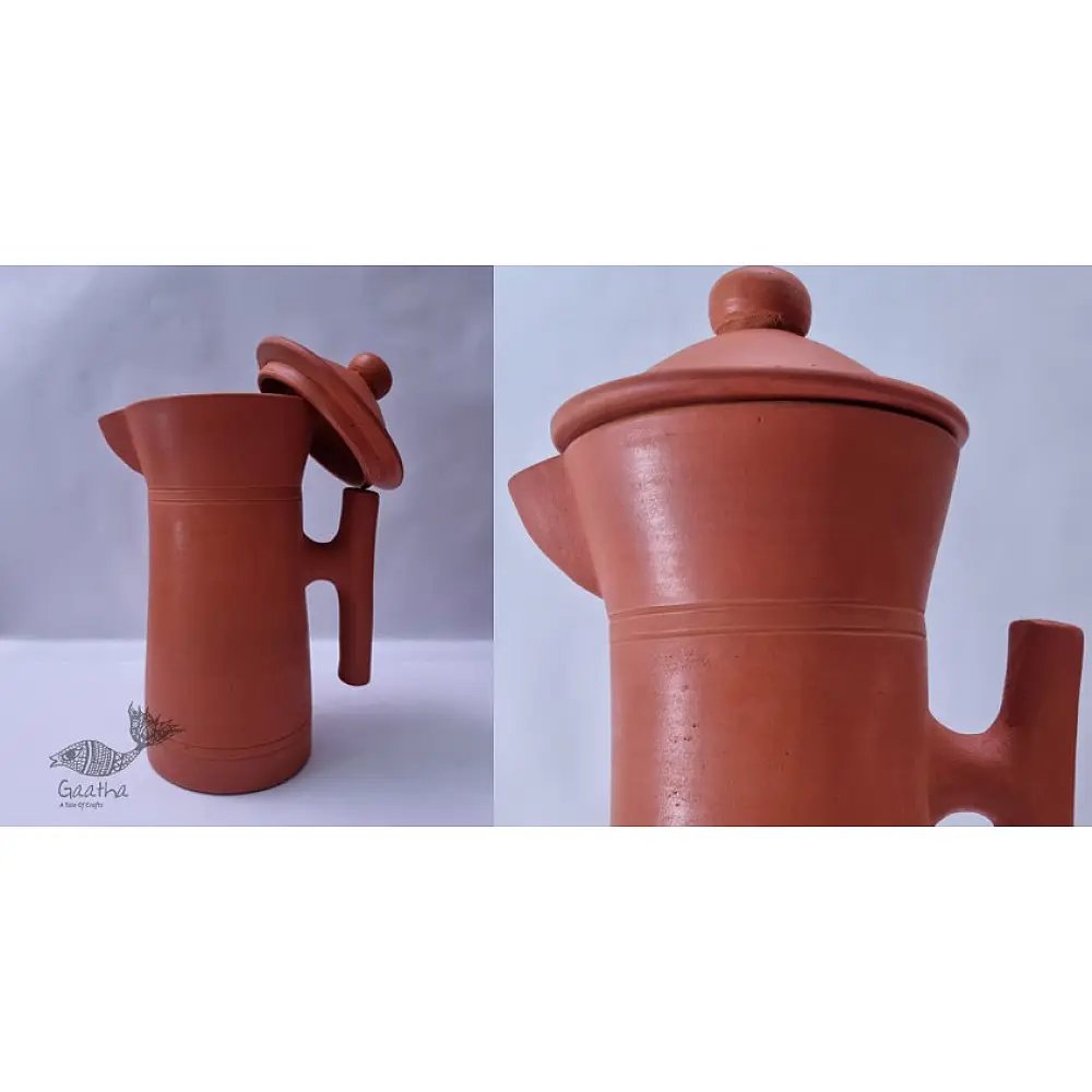 terracotta clay designer jug with fitted lid and curved handle in natural earthy tone