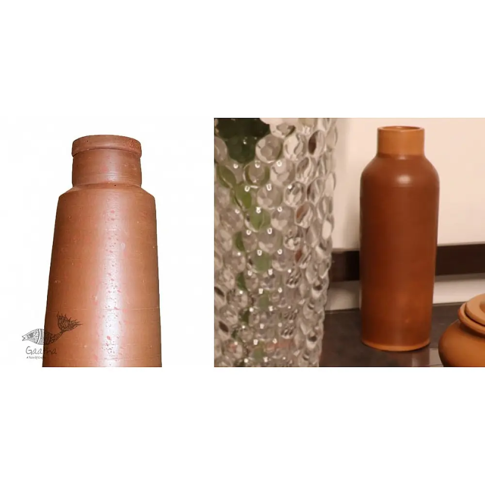 terracotta clay water bottle with tapered conical base and cylindrical neck in natural earthy tone