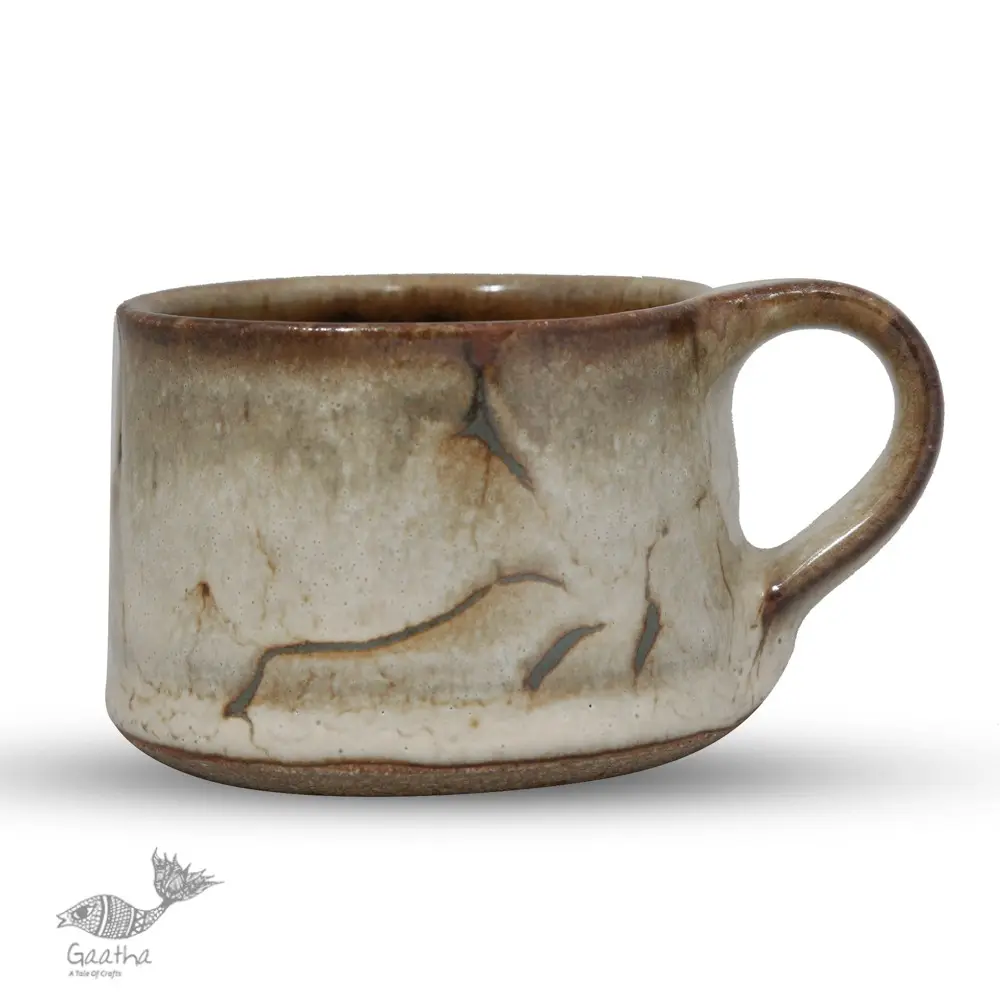 handmade studio ceramic tea cups set of two in light beige brown speckled glaze with hand painted minimal leaf art