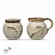 off-white and brown ceramic sugar pot and milk jug set with hand-painted swirl motif
