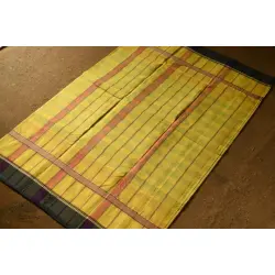 Iravati .  इरावती  - Narayanpet Handwoven Yellow Saree With Green Border