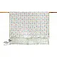 mauve and white block printed baby quilt with whimsical unicorns and rainbows pattern draped over a crib