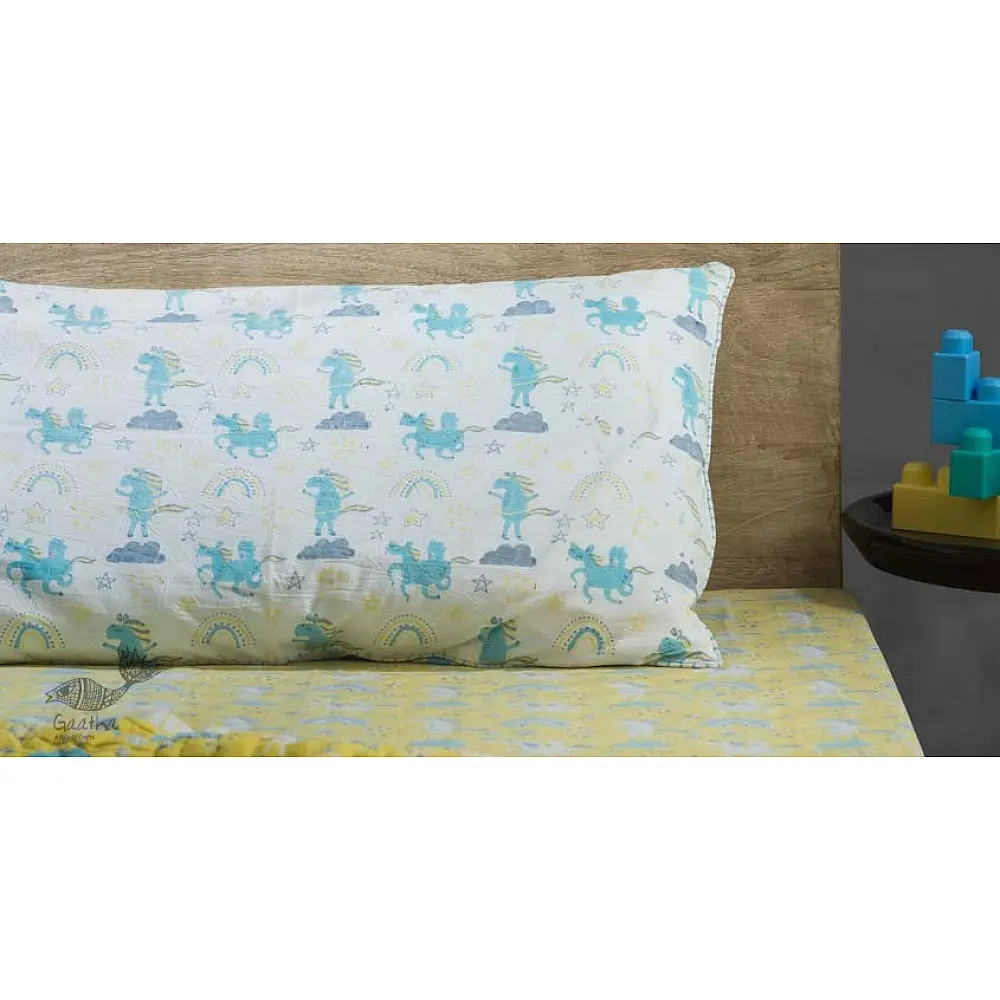 sunny side up yellow and blue block printed baby bedding set with dancing unicorns pattern including pillowcase and bedsheet