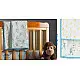 blue fog block printed baby dohar blanket with whimsical monkey and bananas pattern draped over a crib