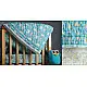 blue and teal block printed baby quilt with whimsical unicorns and rainbows pattern draped over a crib