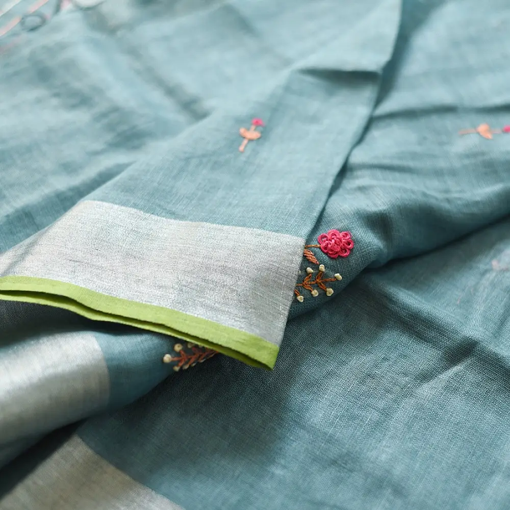 handloom pure linen sea green saree with striped palla subtle grid pattern delicate hand embroidery and tasselled pallu