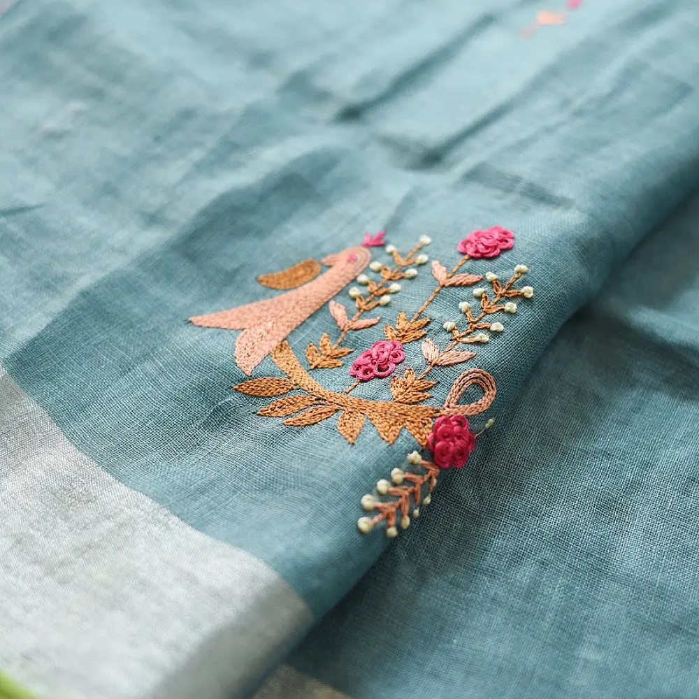 handloom pure linen sea green saree with striped palla subtle grid pattern delicate hand embroidery and tasselled pallu