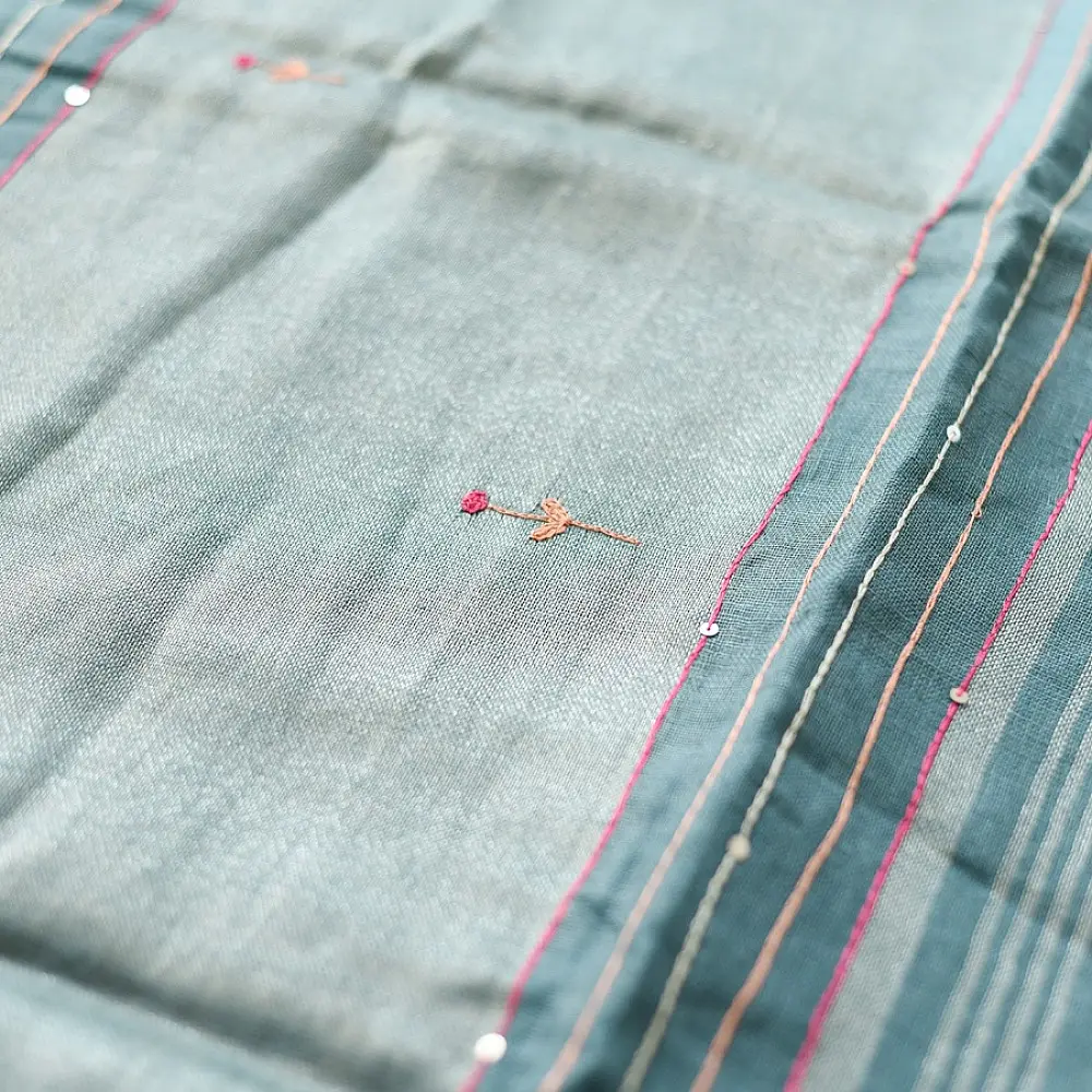 handloom pure linen sea green saree with striped palla subtle grid pattern delicate hand embroidery and tasselled pallu