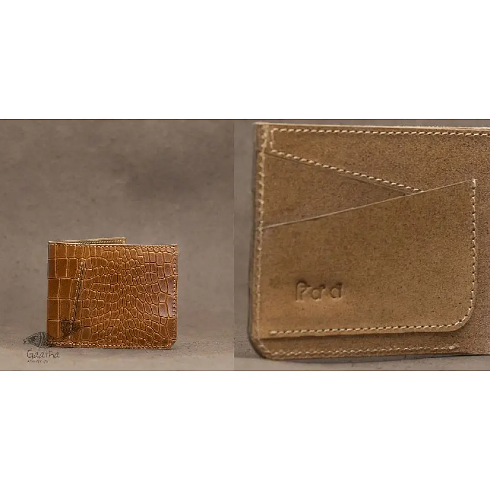 handcrafted light brown vegetable tanned leather bifold wallet with crocodile embossed exterior and a structured card slot interior featuring a debossed logo