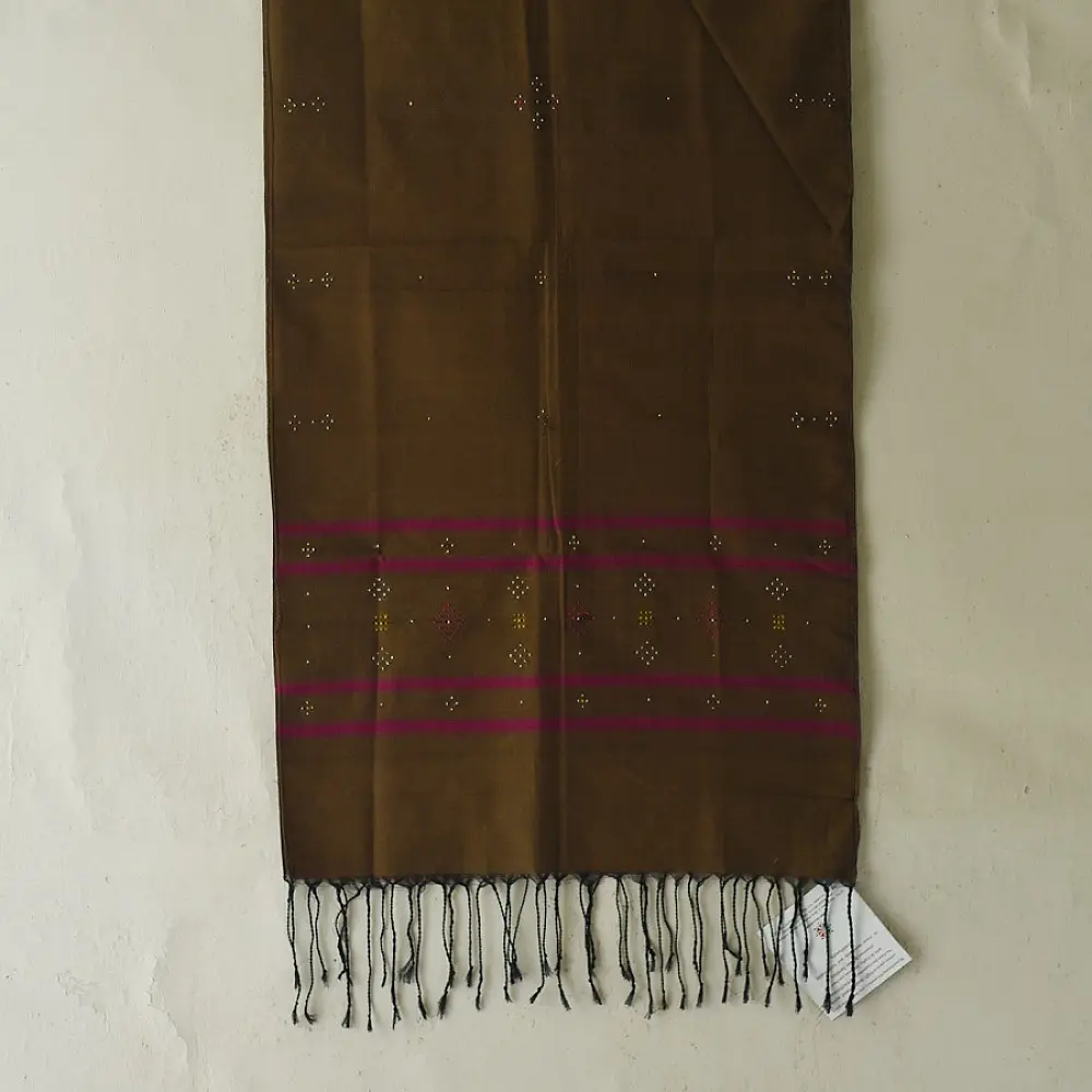 tangaliya handloom cotton stole in earthy olive brown with magenta pink stripes, white and yellow raised dana bead motifs, and hand-knotted fringe tassels   