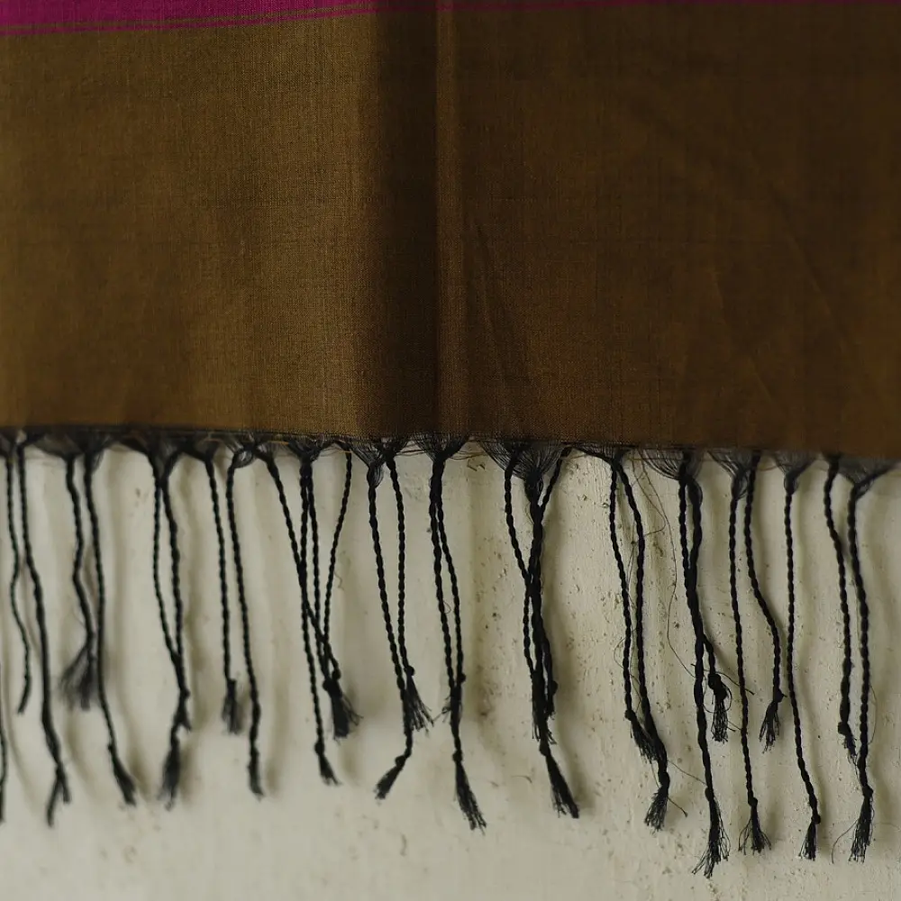 tangaliya handloom cotton stole in earthy olive brown with magenta pink stripes, white and yellow raised dana bead motifs, and hand-knotted fringe tassels   