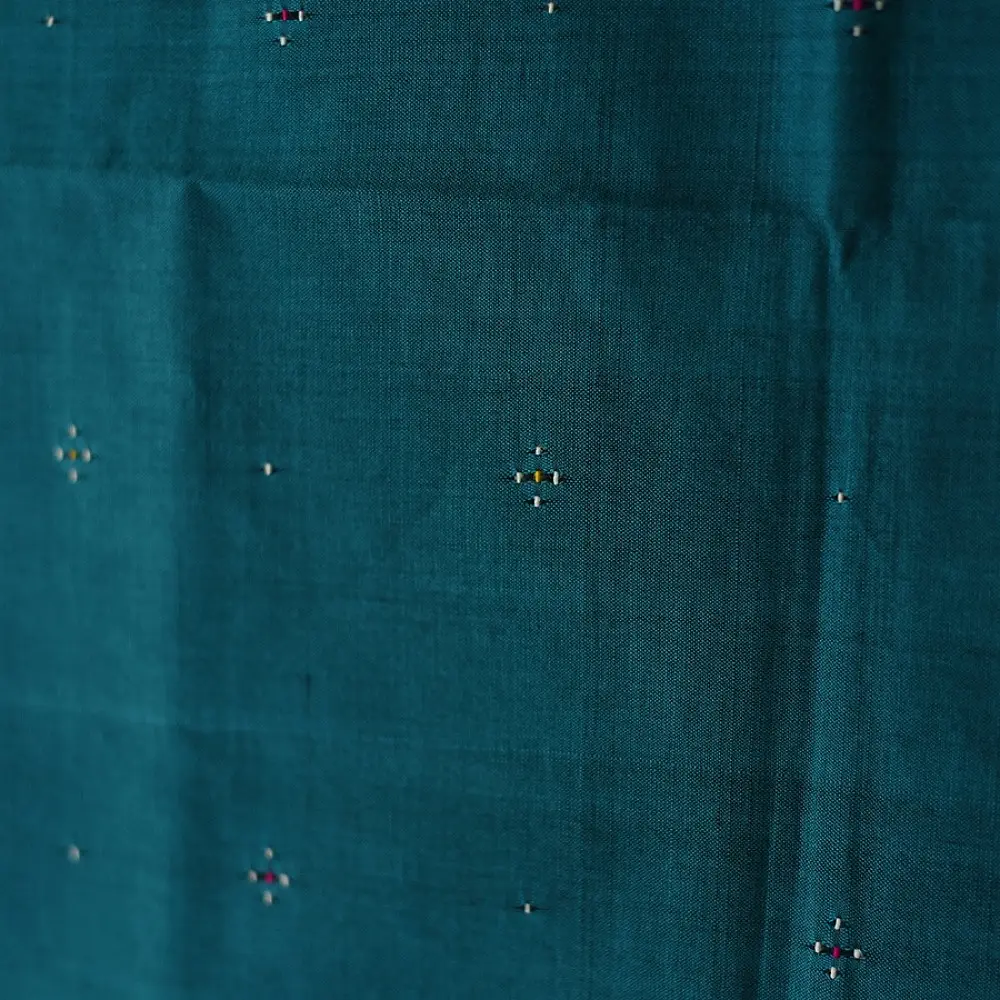 tangaliya handloom cotton stole in ocean teal blue with maroon red stripes, yellow and white raised dana bead motifs, and hand-knotted fringe tassels