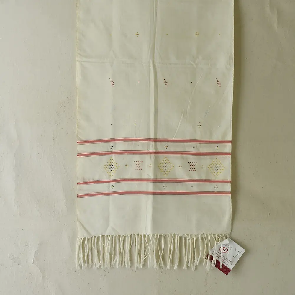 tangaliya handloom cotton stole in natural off-white cream with fine red pinstripes, yellow and red raised dana dot motifs, and fringe tassels
