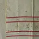 tangaliya handloom cotton stole in natural off-white cream with fine red pinstripes, yellow and red raised dana dot motifs, and fringe tassels
