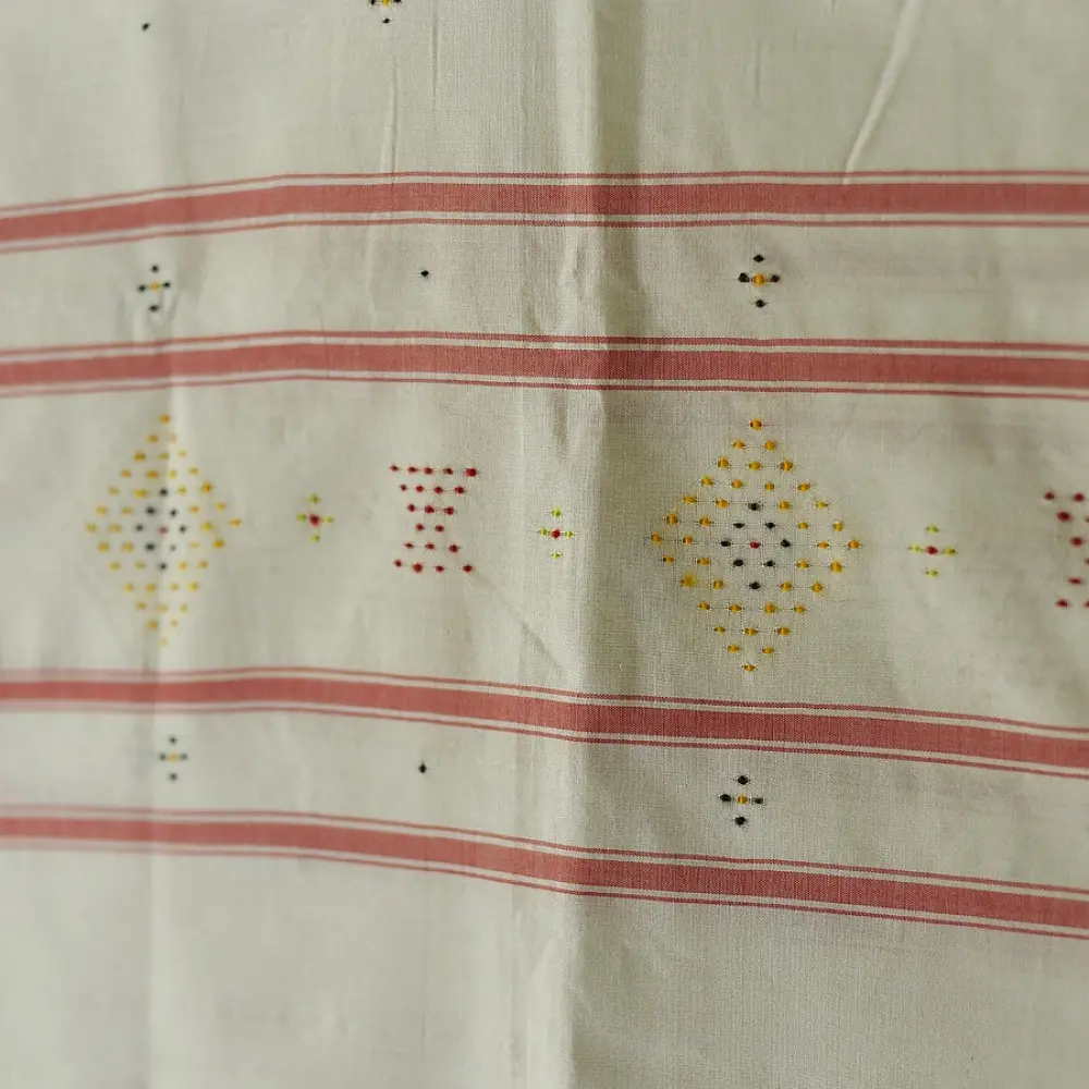 tangaliya handloom cotton stole in natural off-white cream with fine red pinstripes, yellow and red raised dana dot motifs, and fringe tassels