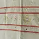 tangaliya handloom cotton stole in natural off-white cream with fine red pinstripes, yellow and red raised dana dot motifs, and fringe tassels