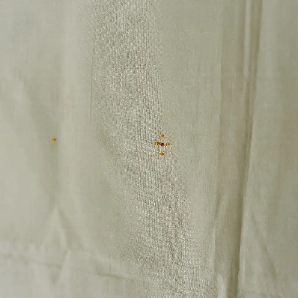 tangaliya handloom cotton stole in natural off-white cream with fine red pinstripes, yellow and red raised dana dot motifs, and fringe tassels