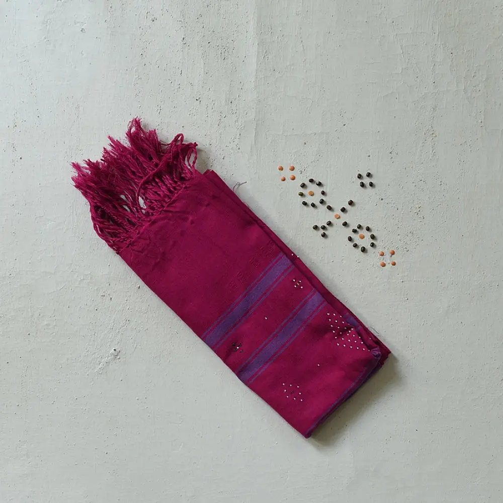 tangaliya handloom cotton stole in vibrant rani pink with indigo blue stripes, white raised dana bead motifs, and hand-knotted fringe tassels