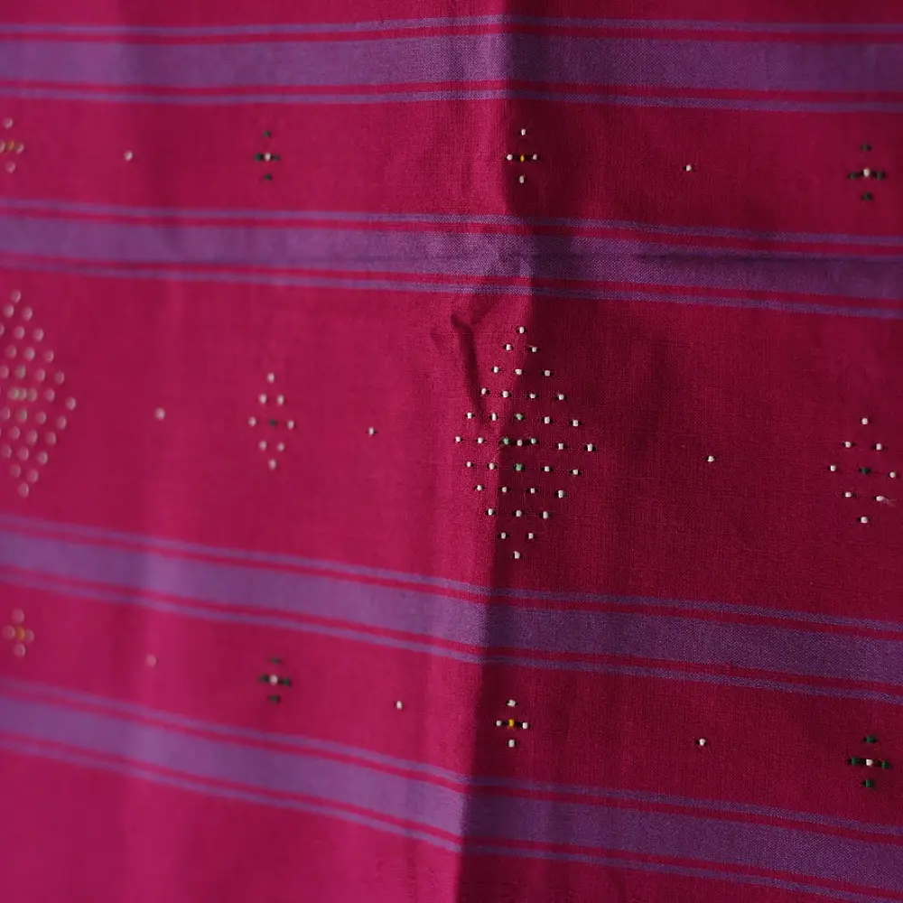 tangaliya handloom cotton stole in vibrant rani pink with indigo blue stripes, white raised dana bead motifs, and hand-knotted fringe tassels
