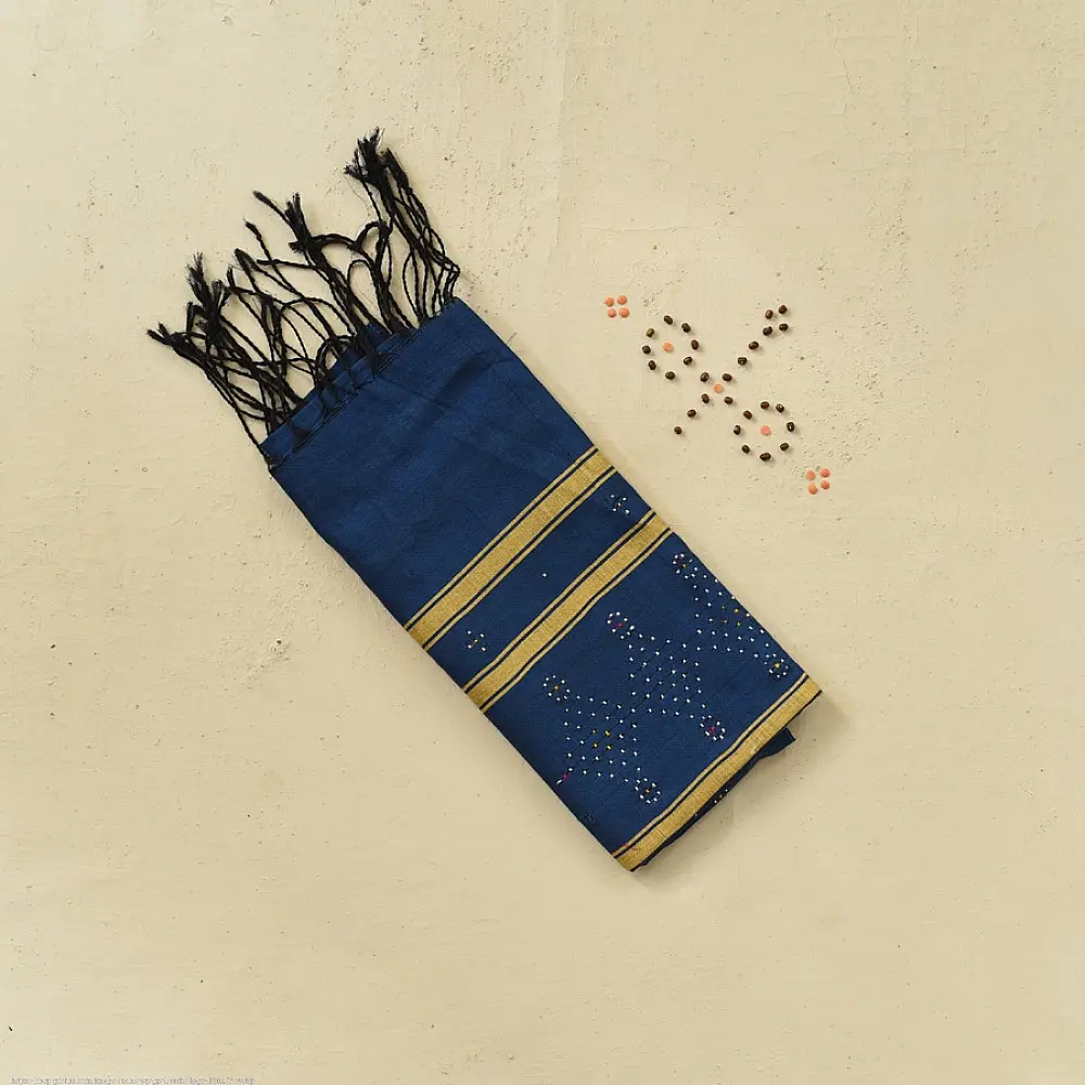 tangaliya handloom cotton stole in deep indigo blue with mustard yellow stripes, raised white dana dot motifs, and hand-knotted fringe tassels