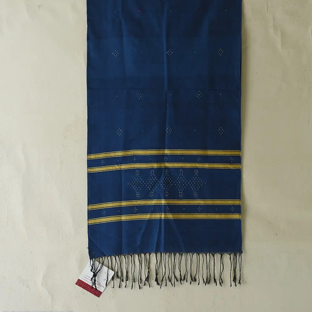 tangaliya handloom cotton stole in deep indigo blue with mustard yellow stripes, raised white dana dot motifs, and hand-knotted fringe tassels