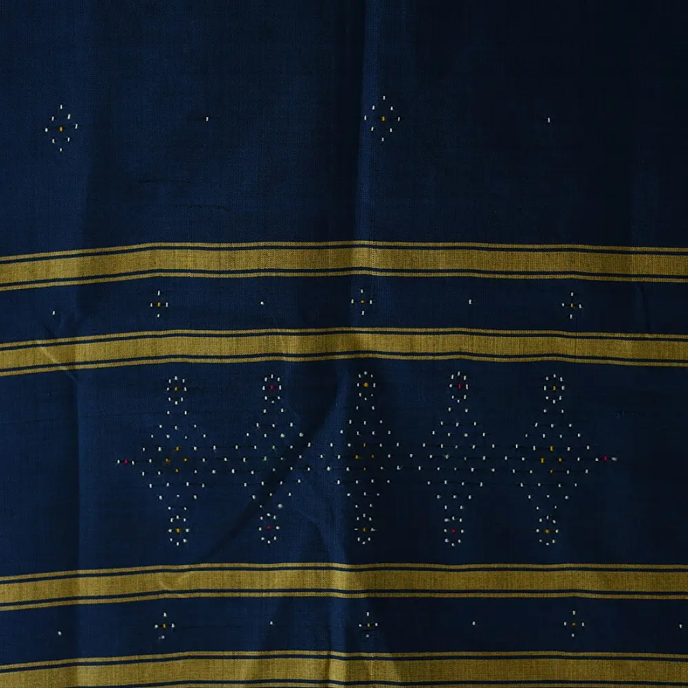 tangaliya handloom cotton stole in deep indigo blue with mustard yellow stripes, raised white dana dot motifs, and hand-knotted fringe tassels